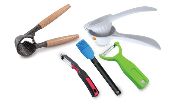 Swissmar kitchen tool assortment. Includes nut cracker, citrus press, peelers and a silicone brush