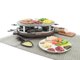 raclette with food on granite stone top, a raclette dish with melted cheese in front of the raclette and a plate full of food 